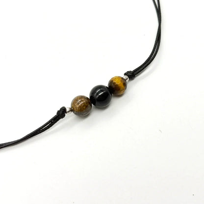 Collar unisex ajustable con nudo corredero y minerales de protección