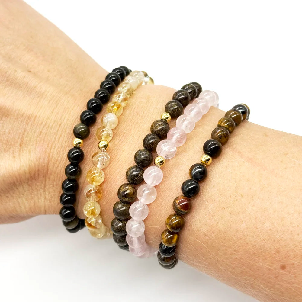 Pulseras de bolas lisas de 6 mm de distintos minerales, entre ellas la de broncita
